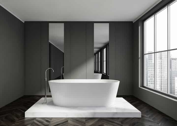 Minimal bathtub installation with grey walls in Caldwell, ID.